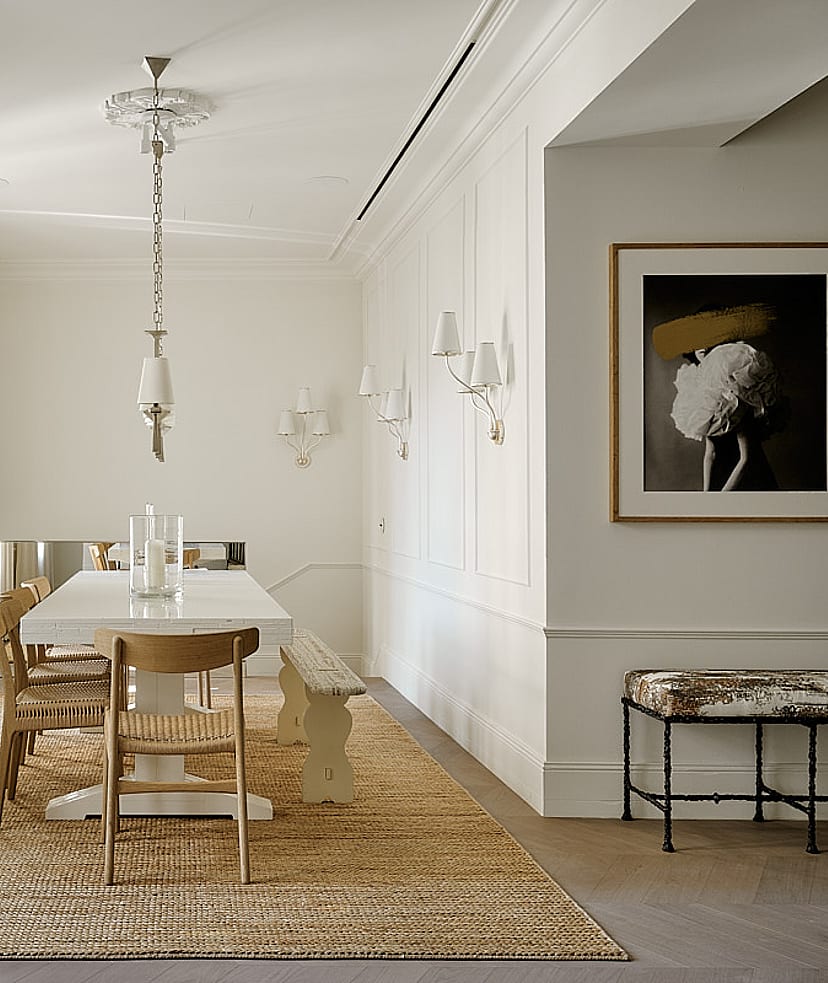 Expansive dining gallery with high ceilings, wooden floor, natural linen seating, windows along full length, and jute rug