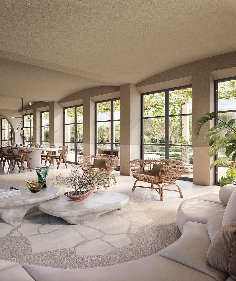 Spacious living and dining room with arched walls, light stone floors, neutral upholstered sofas, and large glass doors.