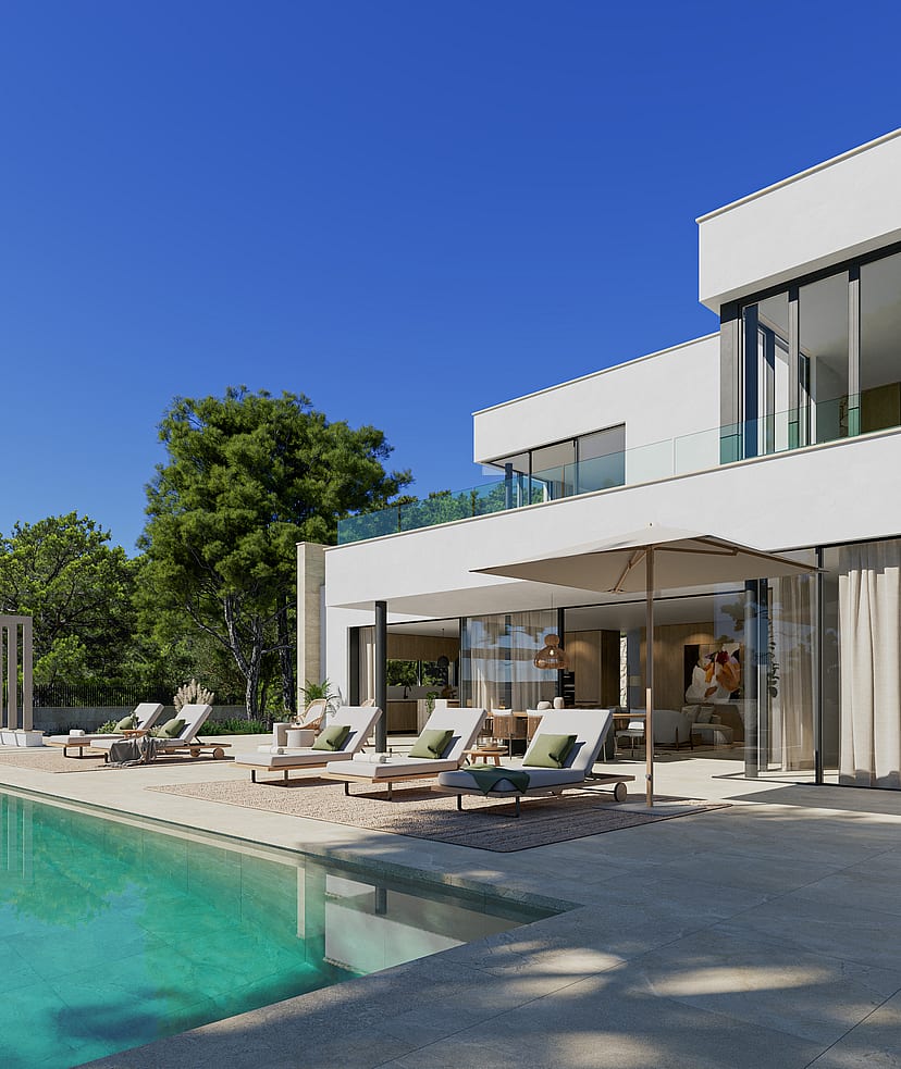 Modern white villa exterior featuring a stone-paved terrace with lounge chairs beside an outdoor swimming pool.