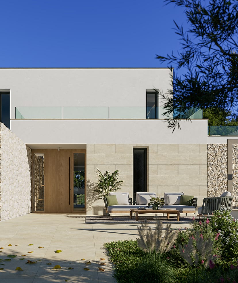 Modern villa exterior with white render and natural stone cladding, featuring a terrace area and olive trees under bright sun.