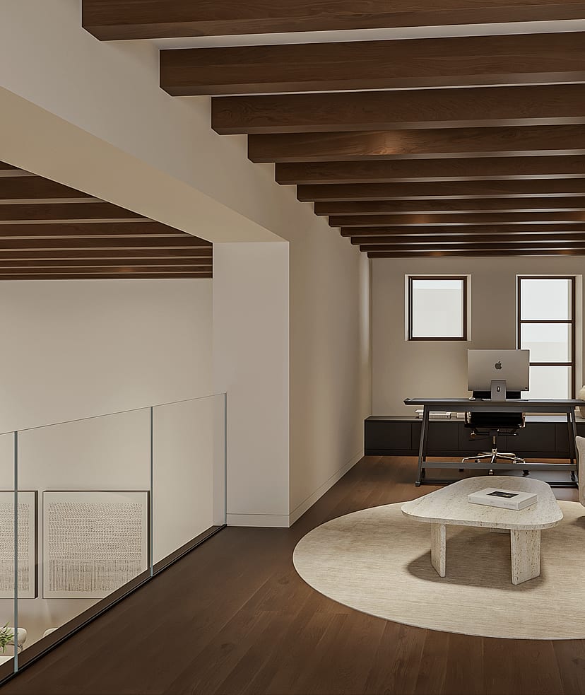Mezzanine used as a home office with desk and sofa, glass balustrade and exposed dark timber beams overlooking the level below.