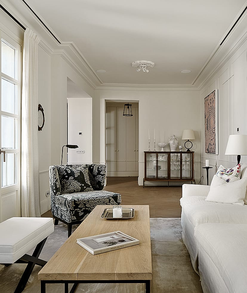 Private rooftop terrace with cream-coloured lounge seating, potted olive trees, Mediterranean planting, and panoramic views of Palma Cathedral