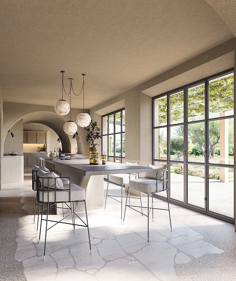 A bright kitchen area with arched stone ceilings, stone floors, and black-framed glass doors leading to a garden.