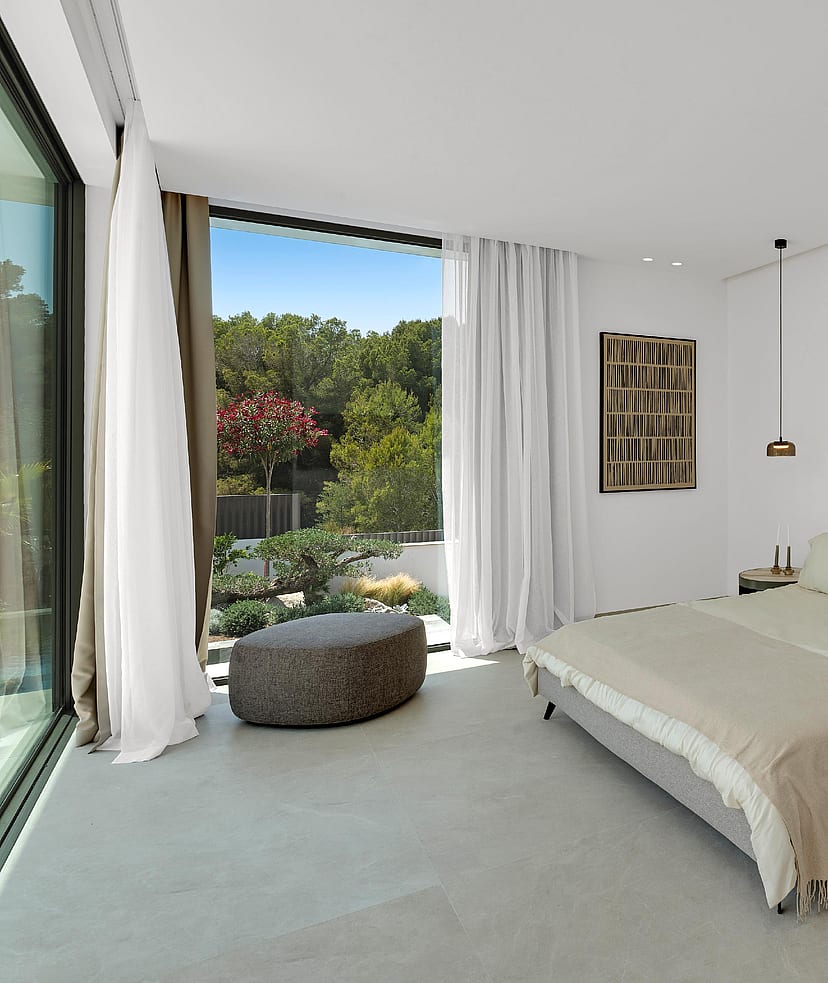 ight-filled en-suite bedroom with sliding glass door onto private terrace