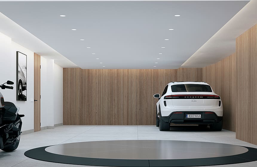 Wide view of a clean modern garage featuring a circular vehicle turntable, slatted oak wall paneling, and recessed lighting.