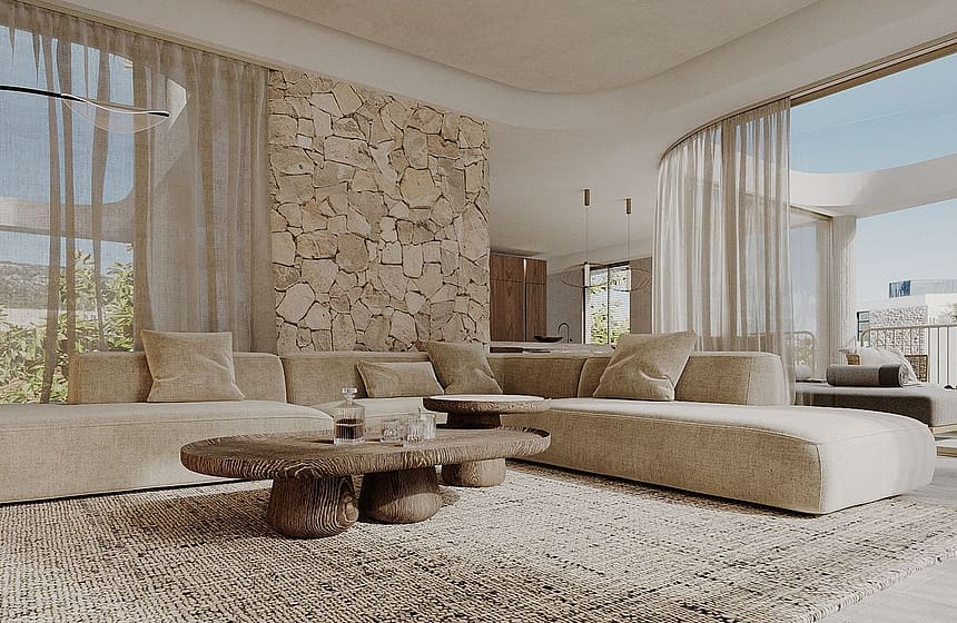Modern living room with a large beige sectional sofa, a carved wood coffee table, and a feature wall made of round stone logs.