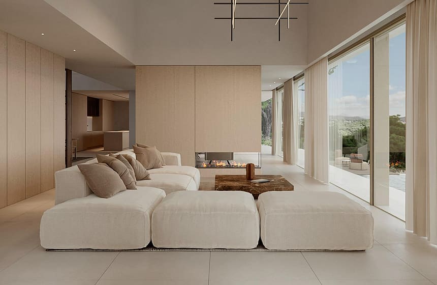 Double-height living room with a suspended fireplace and pool views