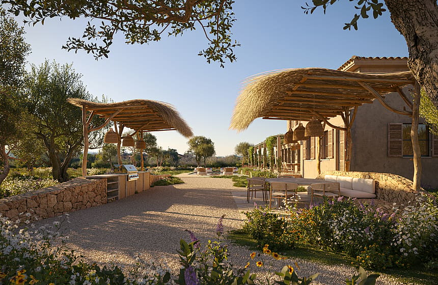 A graveled garden patio in Santa Maria featuring two rustic woven reed pergolas, stone border walls, and native Mediterranean planting.