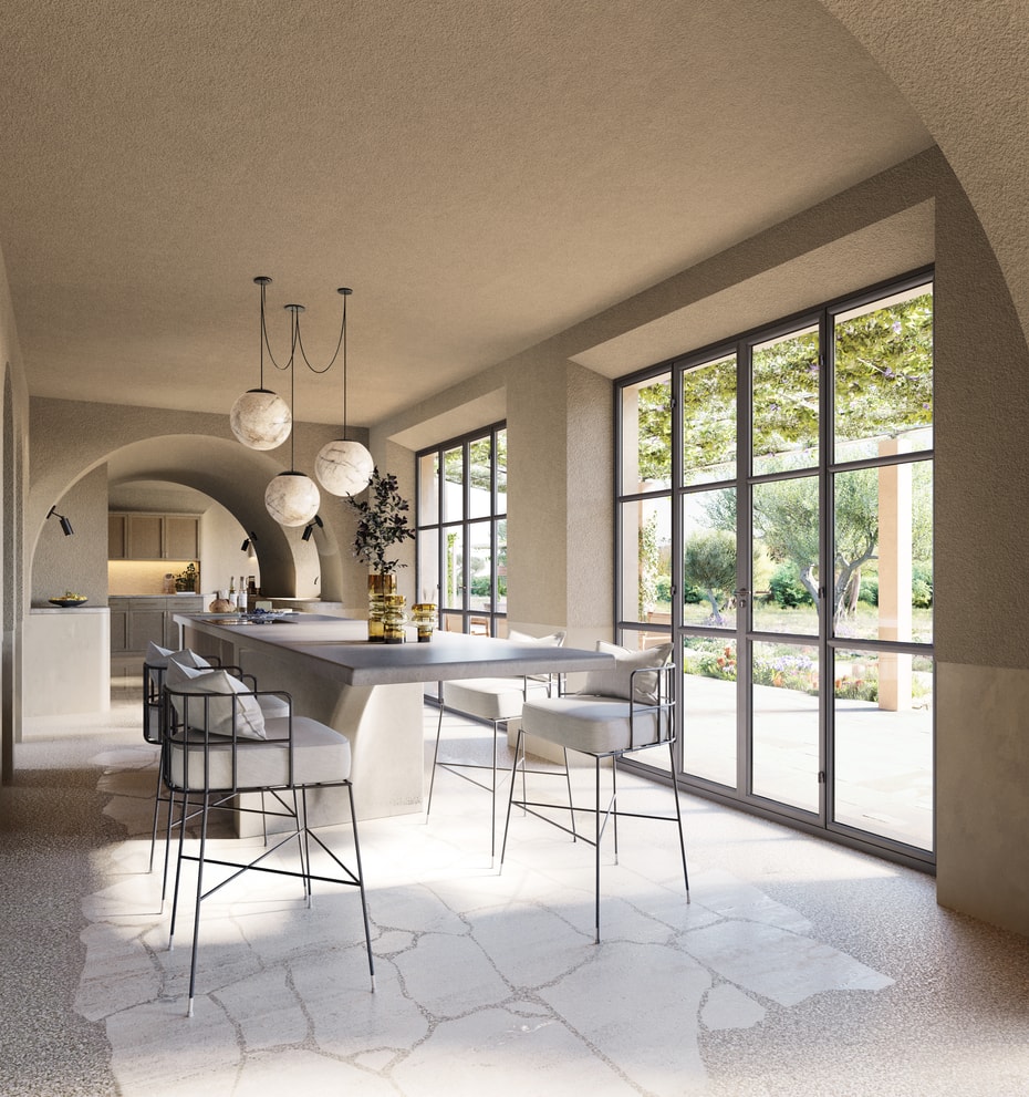 A bright kitchen area with arched stone ceilings, stone floors, and black-framed glass doors leading to a garden.