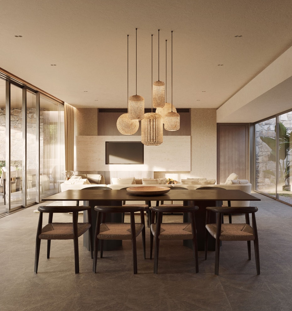 Dining room with long dark wooden table and woven chairs, glass walls opening to a lush garden, and a modern tiered chandelier.